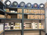 a room with a lot of boxes and cans on the shelves