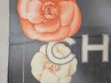 a sign that says chicago with flowers on it