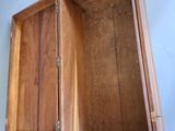 a wooden box that is open on a white surface