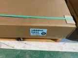 a cardboard box with a green tape on top of it