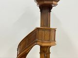 an image of a wooden stair case with a wooden handrail