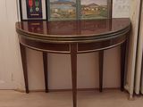 a table with pictures on it and a radiator in the corner