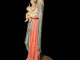 an image of a statue of a woman holding a baby