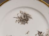 a plate with a floral design on it on a table