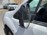 a side view mirror of a car that is parked on the side of the road