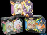 three different types of pokemon trading cards in a tin box