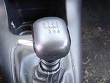 an image of a car ' s gear lever in the center console