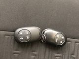 two remote controls on the back of a car