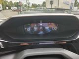 the dashboard of a car with a digital display on it