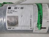 une photo d'un rouleau de tissu emballé dans du plastique