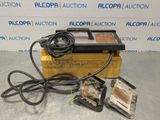 a yellow box with some wires and a power cord