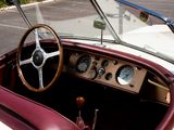 a steering wheel and dashboard of a car in a parking lot