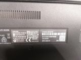 the back panel of a laptop computer with a sticker on it