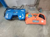 two electric tools that are sitting on the floor