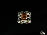 une image représentant une bague ornée d'une citrine entourée de diamants