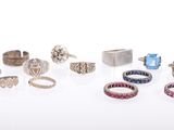 many different types of rings on a white surface