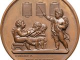 an image of a bronze medal with a picture of a man and a woman