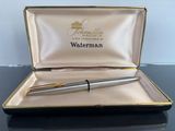 a pen sitting in a box on a table