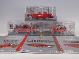 three red toy cars sitting on top of each other in a display case