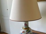 a lamp that is sitting on a table in a room