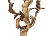 gold leaf sconce with two candle holders on a white background
