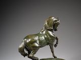 an image of a bronze statue of a horse standing on its hind legs