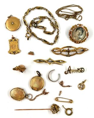 an image of a collection of antique jewelry on a white background