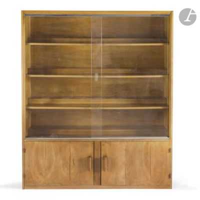 a close up of a wooden bookcase with glass doors