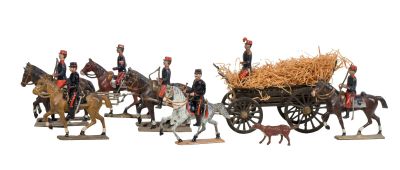 de nombreuses figurines représentant des hommes à cheval ou dans des charrettes