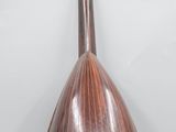 a close up of a mandolin sitting on top of a table