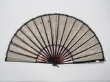 a fan that is hanging on the wall