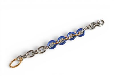 a close up of a blue and silver chain bracelet on a white background