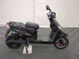 a scooter that is parked in a garage