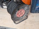a car that has a steering wheel and a hose attached to it