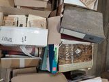 many boxes of books on the floor of this room