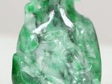 two green glass snuffs with a white background and a white background