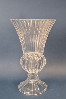 a glass vase that is sitting on a table