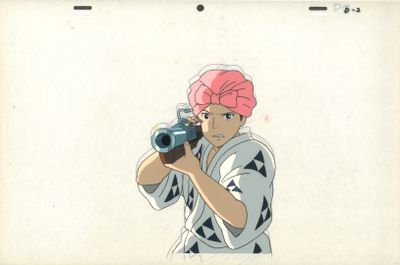 cellule d'animation représentant un homme portant un turban rose et tenant un appareil photo