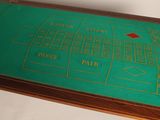 a table that has a green table top with a game on it