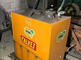 a machine that is sitting on a pallet in a garage