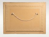 a picture of a picture of a smiling face on a piece of cardboard