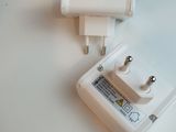 a white charger and a white wall charger on a table