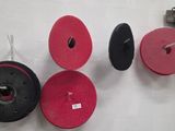 a wall with a bunch of different colored wheels on it
