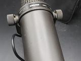 a microphone that is sitting on a table next to a bag