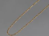 a gold plated necklace with a long chain and a clasp