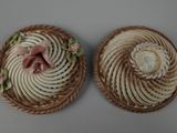 pair of antique hand painted porcelain figurines of flowers and swirls