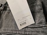 the back of a pair of grey jeans with a tag on it