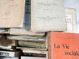 several books are stacked on top of each other on a table