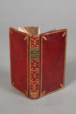 a red book that is open on a table