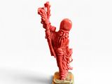 une image représentant une figurine rouge d'un homme tenant une fleur